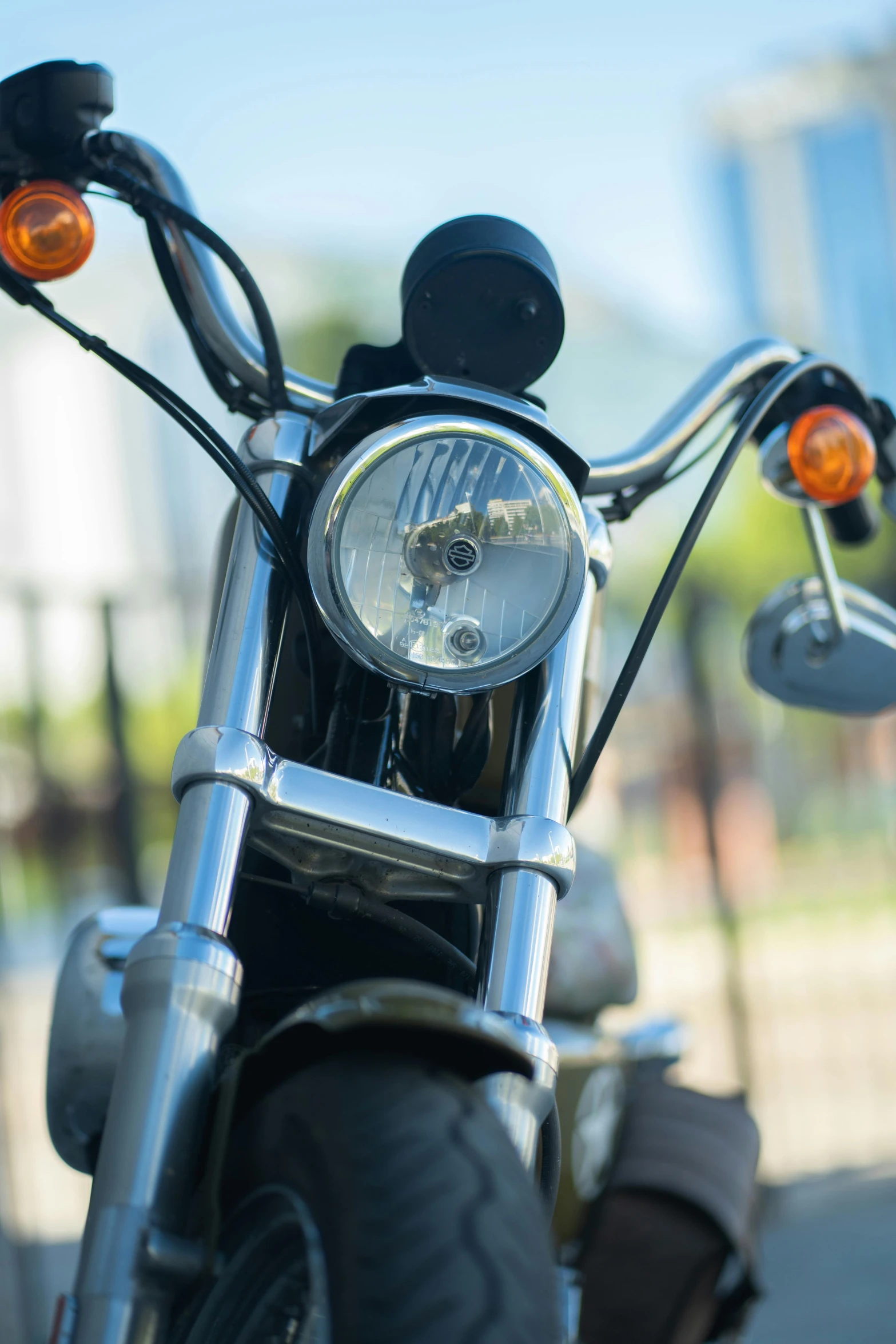 motorcycle with orange lens on the handle bar