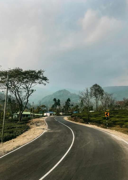 the curve in the road is curved towards the sky