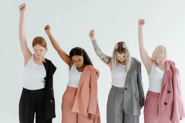 four s standing in front of a white backdrop