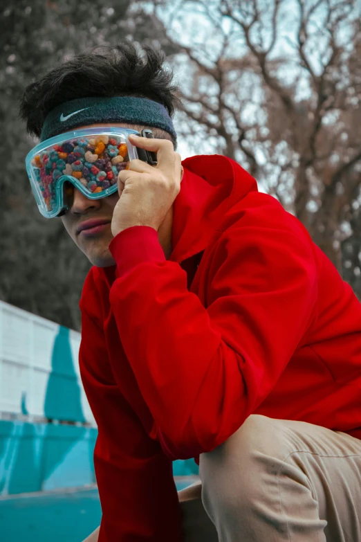 a man is looking into a goggles that's covering his face with cereals