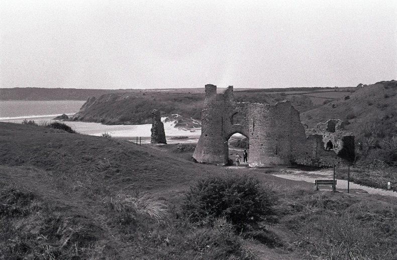 an old, ruinsy stone structure near the water