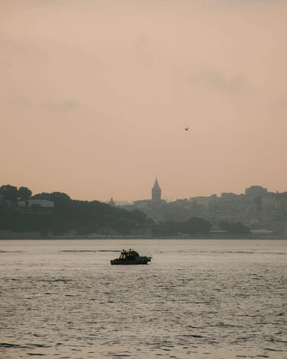 a ferry with a view of a city on the far side