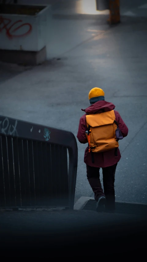 a man with a backpack walking through a dle