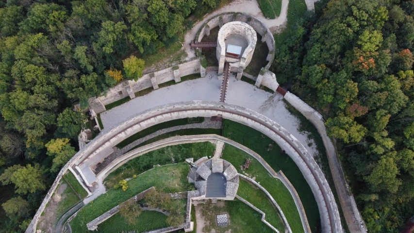 an aerial po of an outside building in the woods