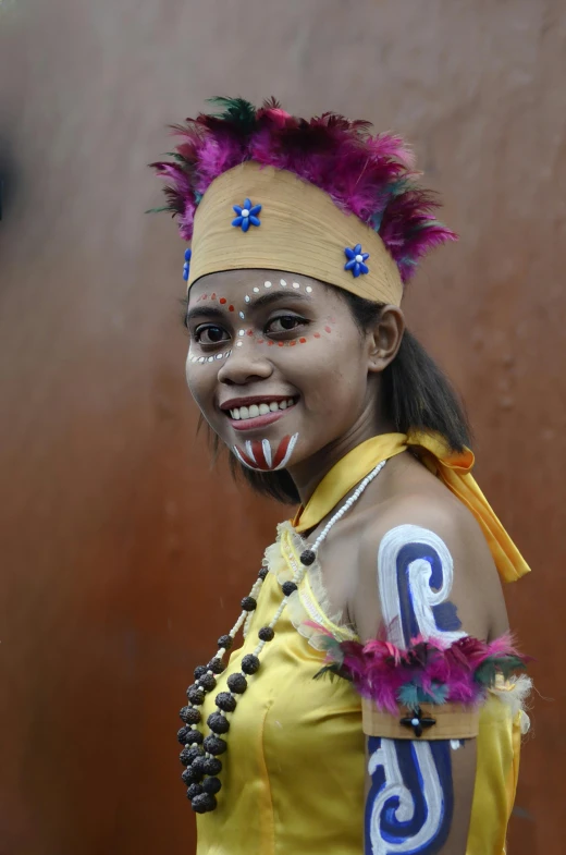 a girl dressed up in costume for a carnival