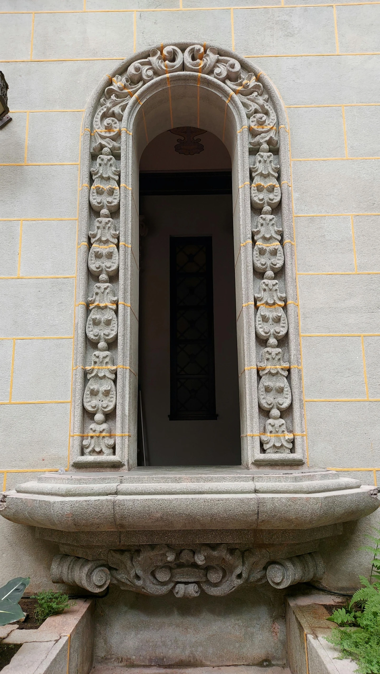 a stone structure with a clock on the side of it