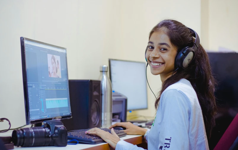 young lady working on her computer at home