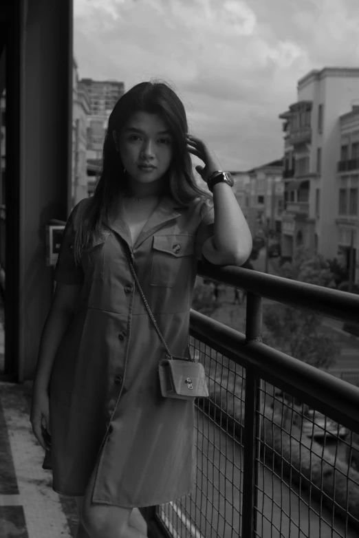 a woman standing in front of some buildings