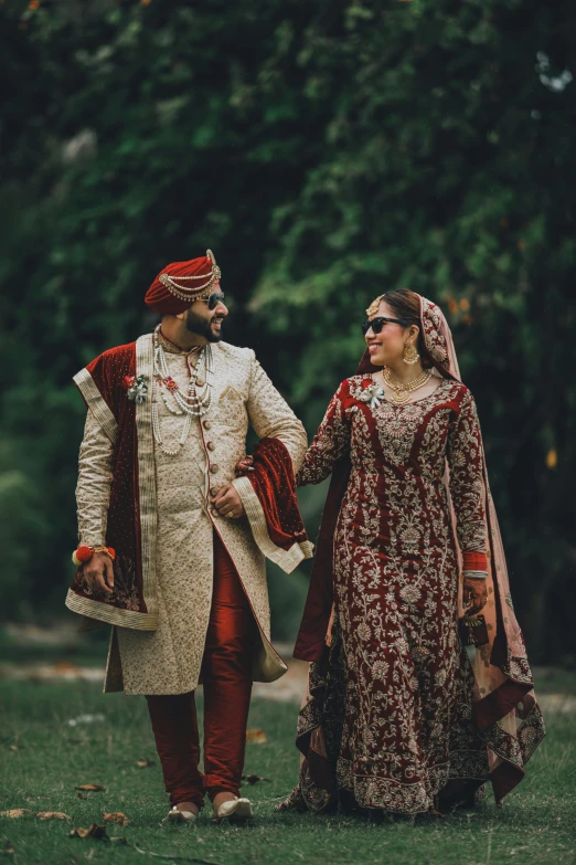 a newly married couple walking together outside