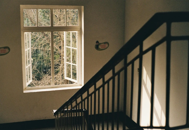 a picture of a window and railing inside a home