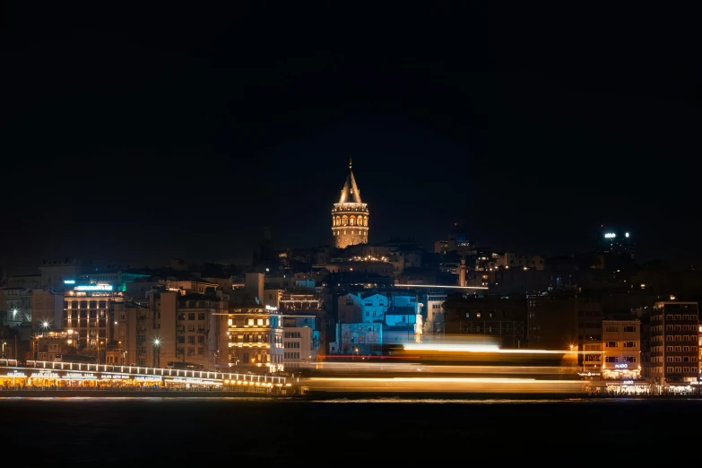 a city skyline is shown at night with the lights of the skyscrs lit up