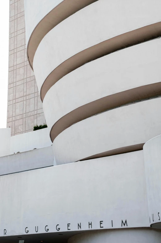 the front of a building that is tall and white