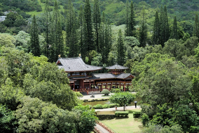an old asian style building among many trees