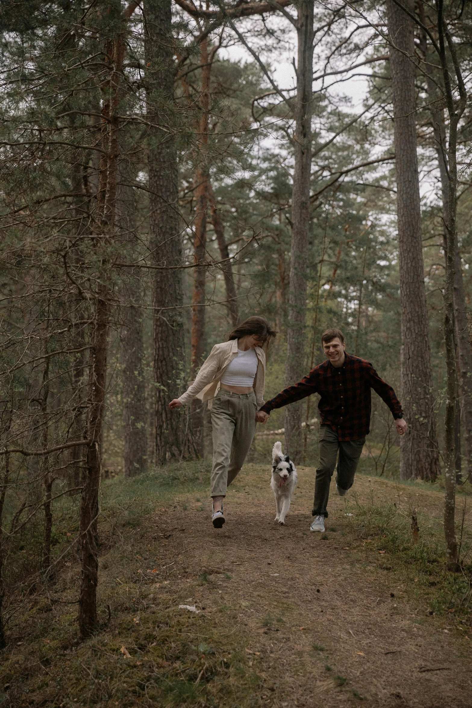 a man and a woman that are walking some dog