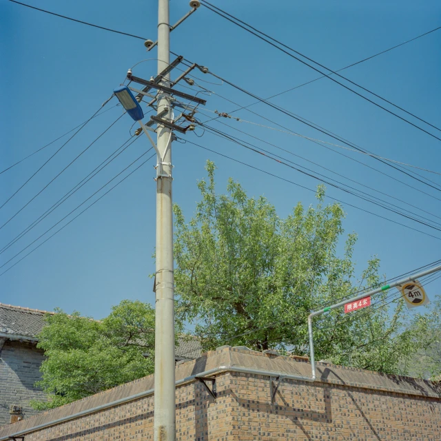 there is a pole that is holding the street light