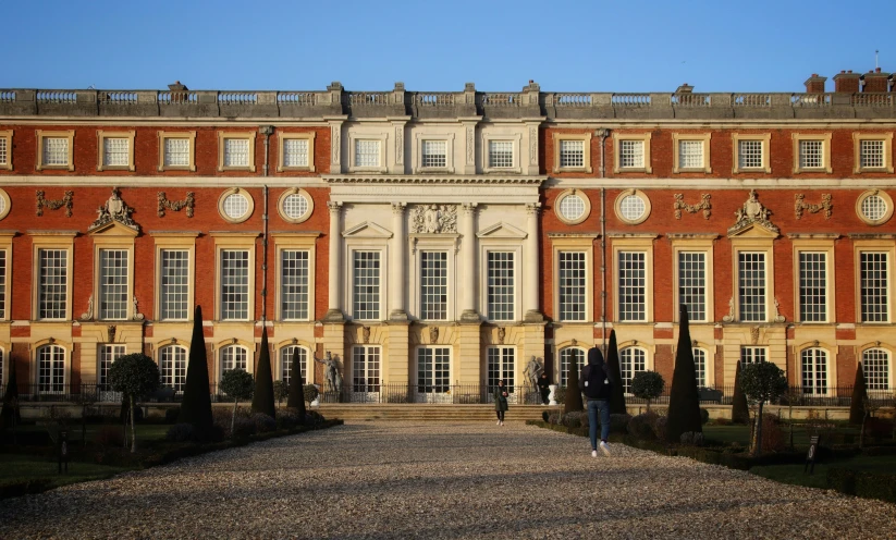 an ornate palace with stone steps and stone landscaping