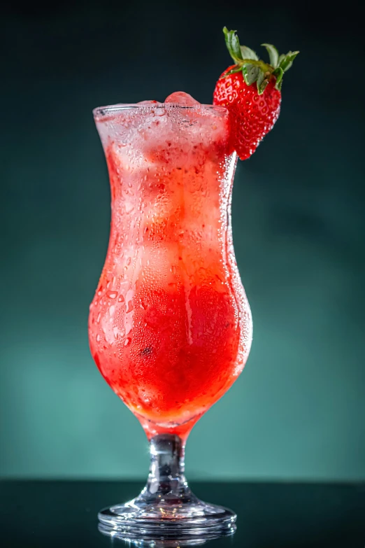 a strawberry drink in a glass on a table