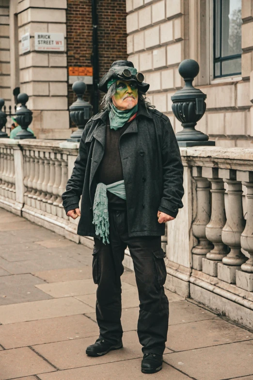 a person with large face paint on his face and hat