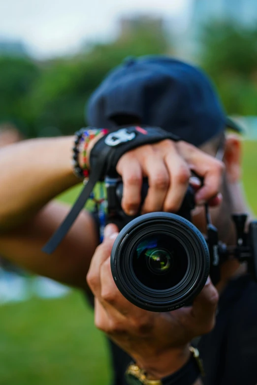 a person taking a picture of themselves in a field with a camera