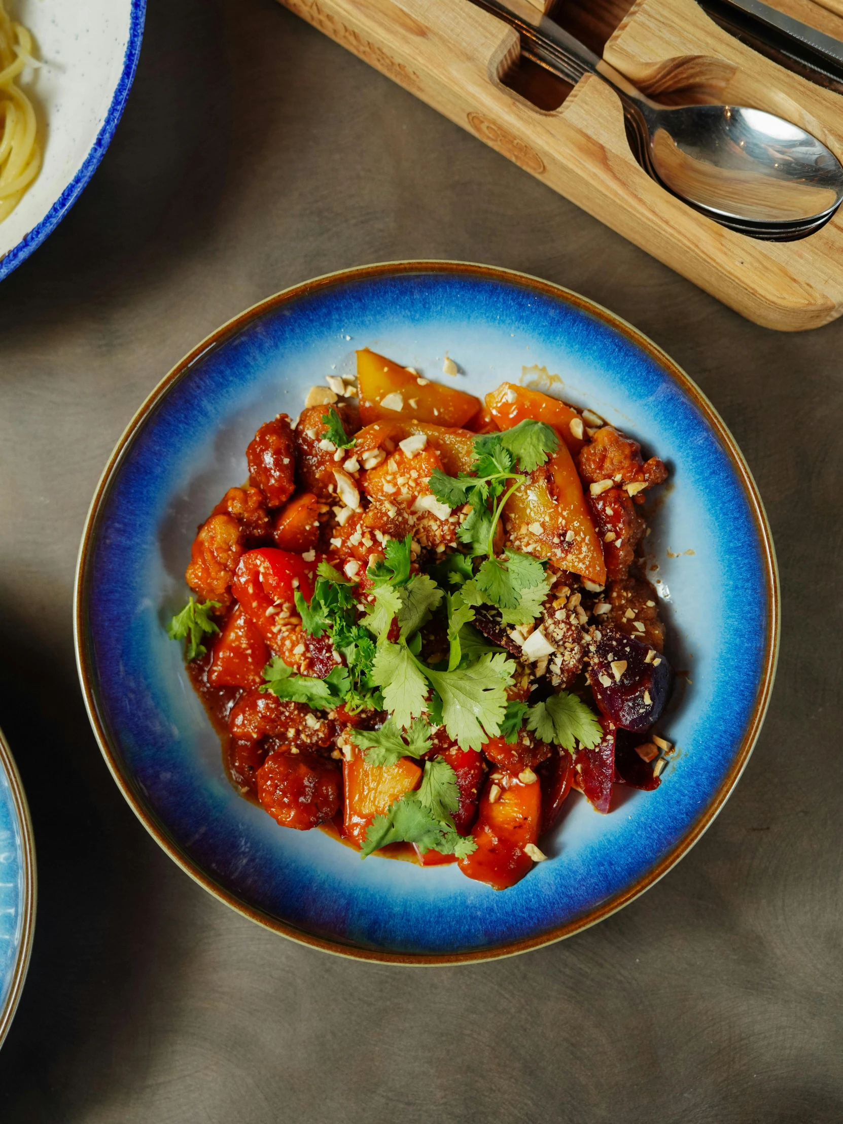 two plates of food sitting on a table