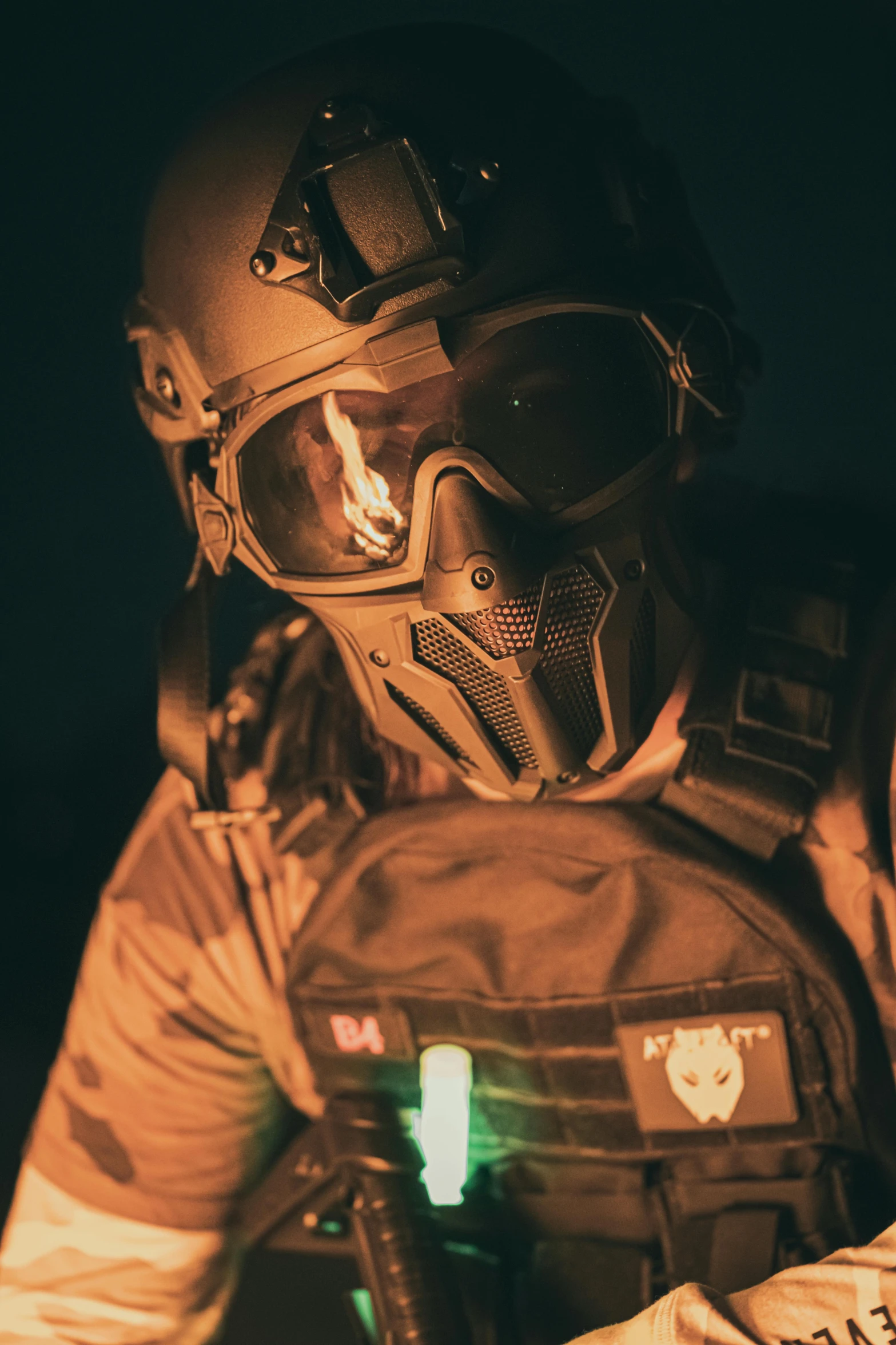 a soldier in camouflage holding his gun with glowing flash at the back