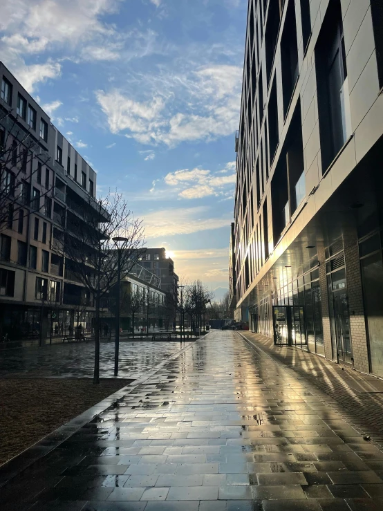 a road with lots of buildings and water on it