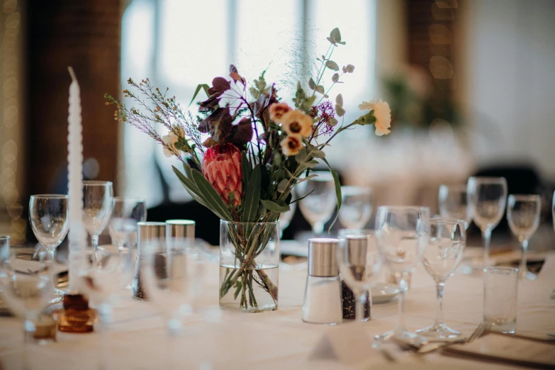 table settings and clear glassware for a wedding reception