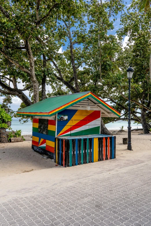 the brightly colored shack has a long strip of stripes on it