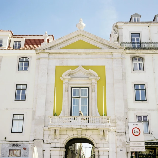 a large white building with a clock tower on top