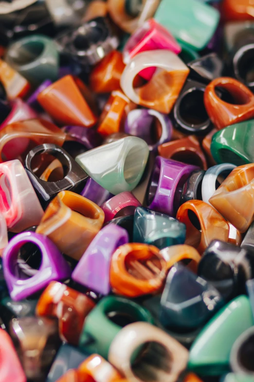 there are many different pieces of colorful jewelry