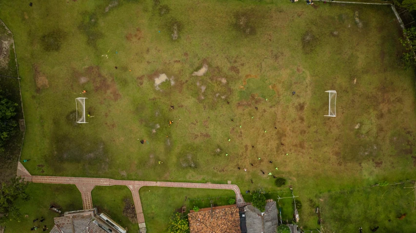 an aerial view of a yard and house in the countryside