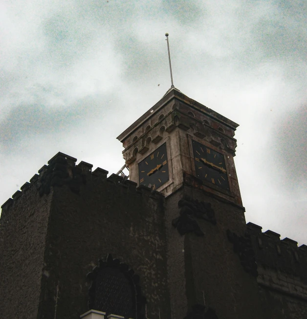 the clock tower is set high on the side of the building