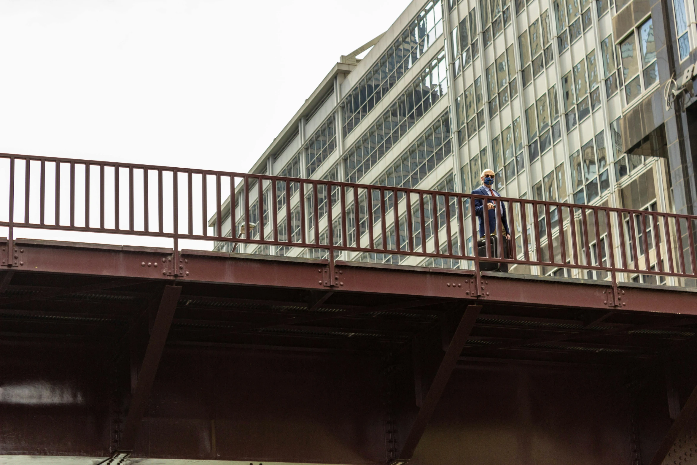 an image of a man standing on a bridge