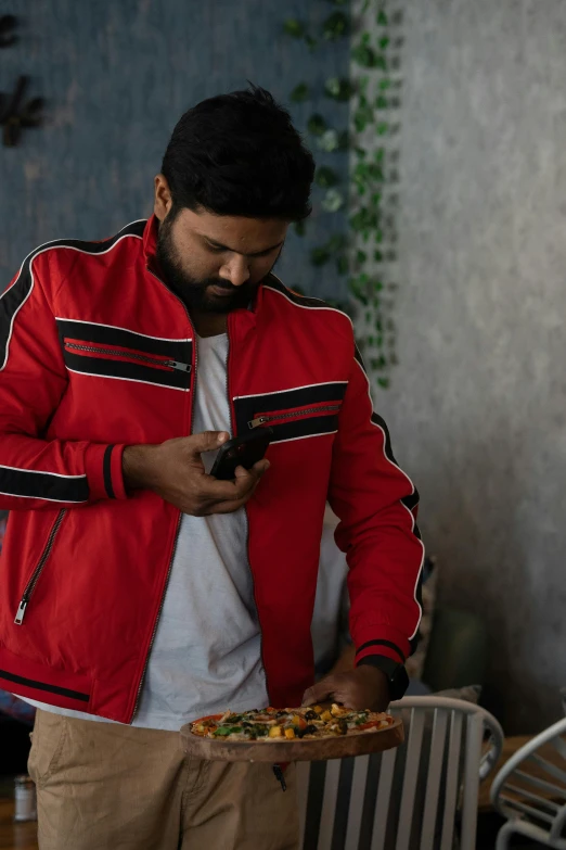 man using mobile phone in a restaurant