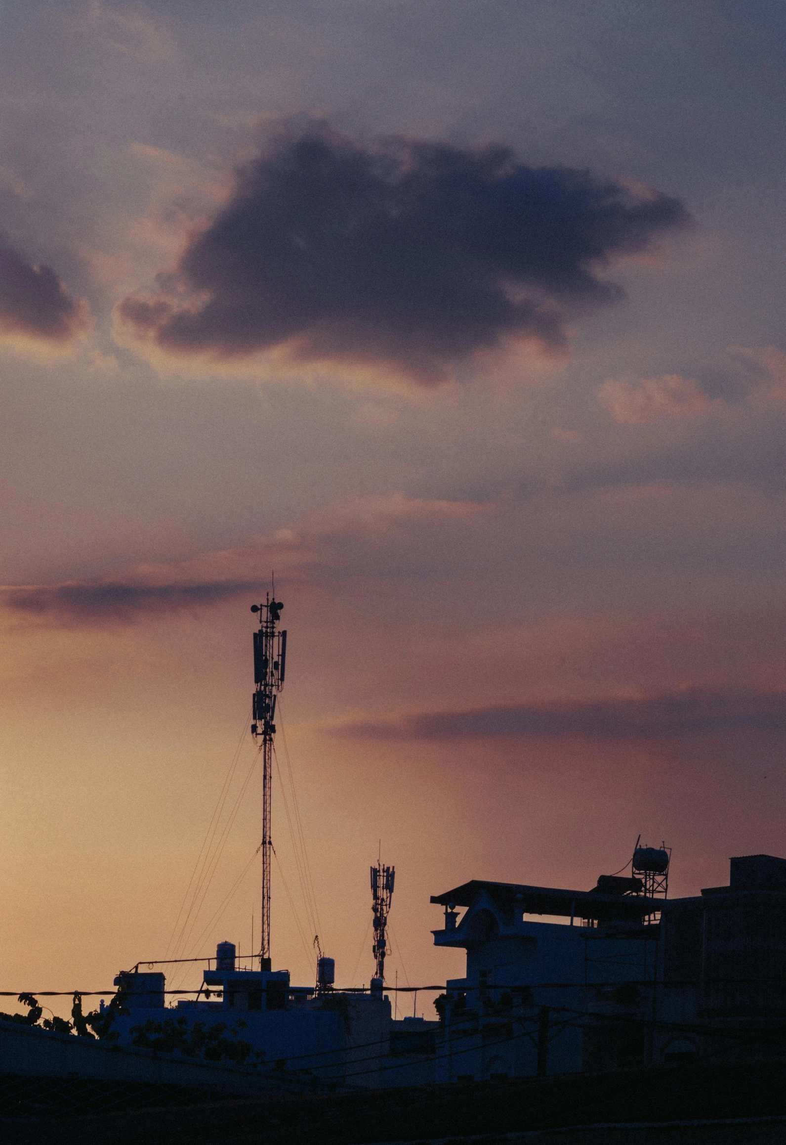 there is a large tower against the evening sky