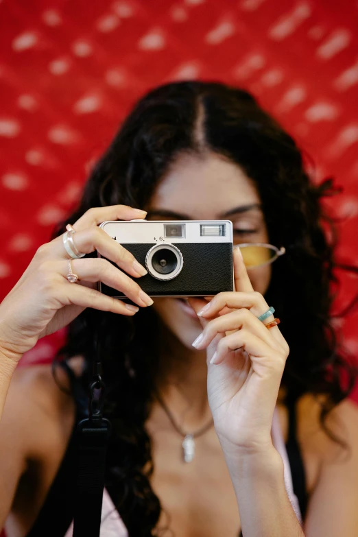 a person taking a picture with a camera