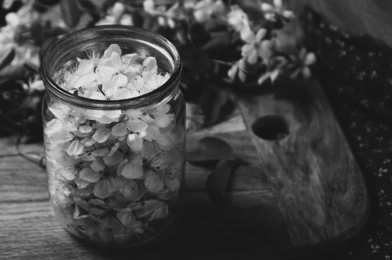 there is a jar with flowers in it