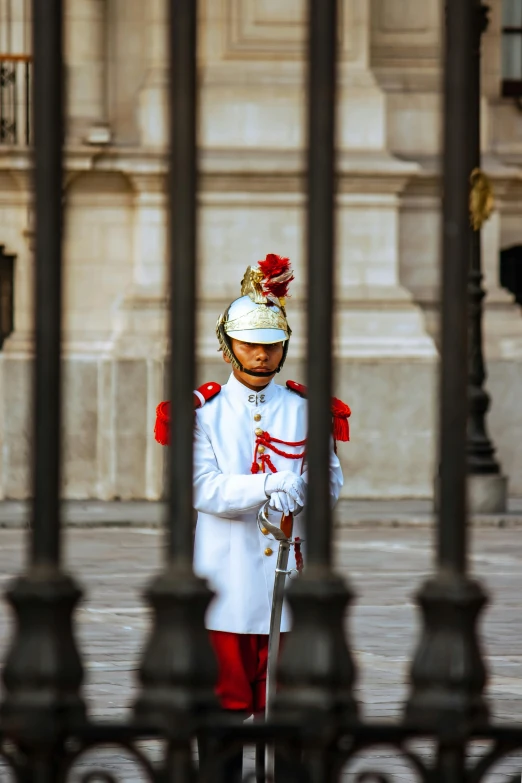 the guardman is dressed in uniform outside a building