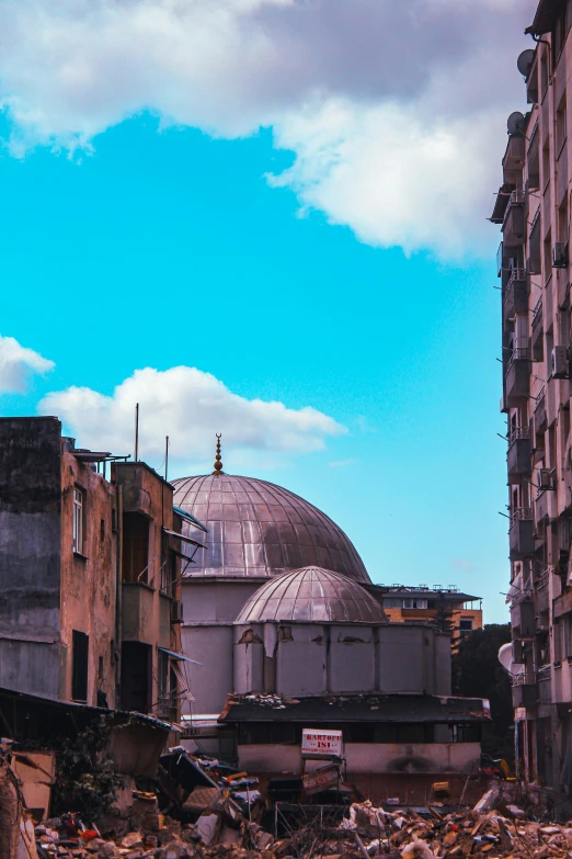 view of a rooftop from the street looking down on garbage