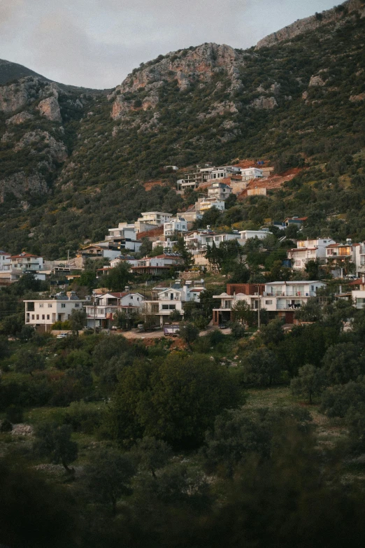 a city on a hill surrounded by mountains