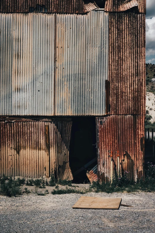 an old building with a broken down door