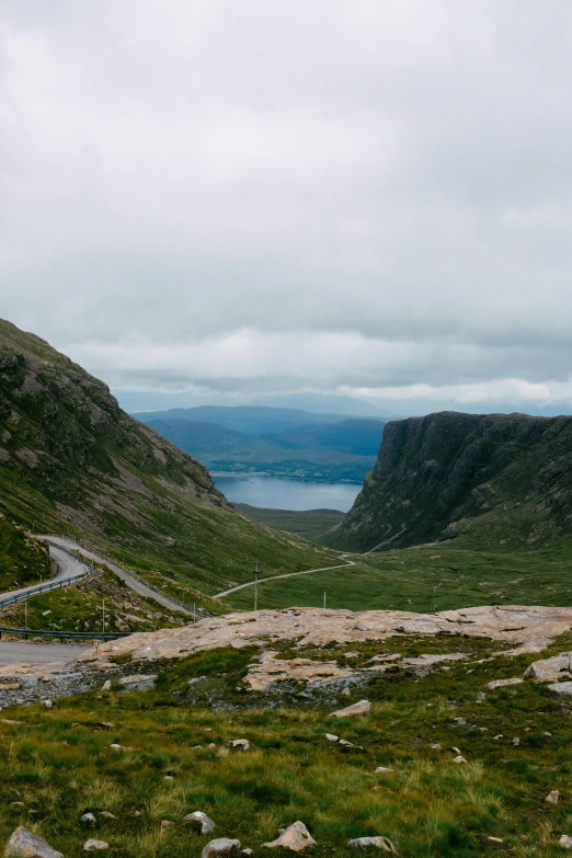 a scenic view of a road going through the mountains