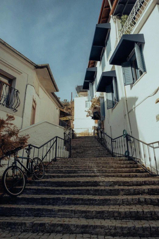 several bikes sitting on the steps of a building