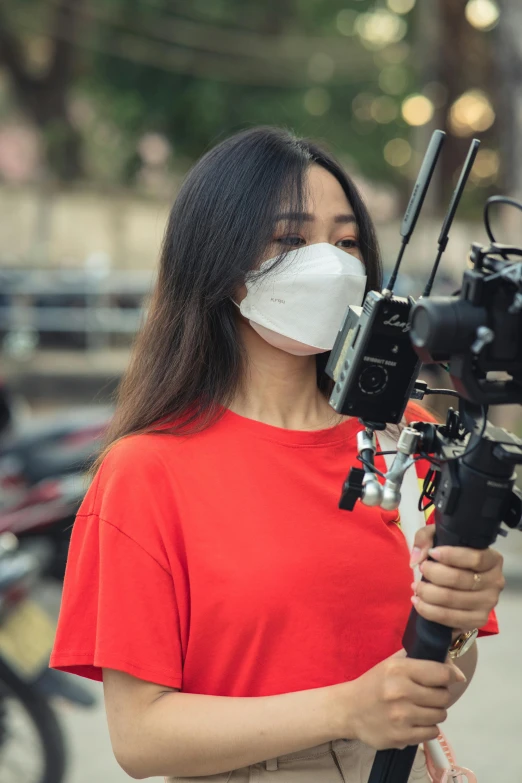 a woman is taking a picture with a camera