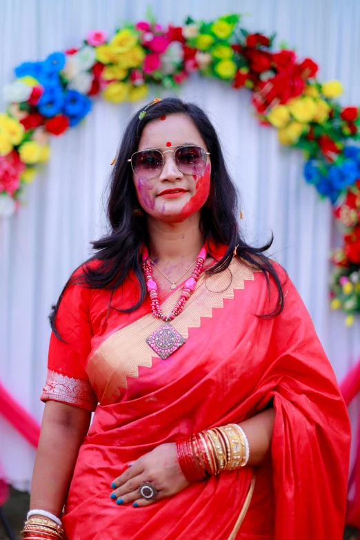 a woman wearing a colorful sari at a indian wedding