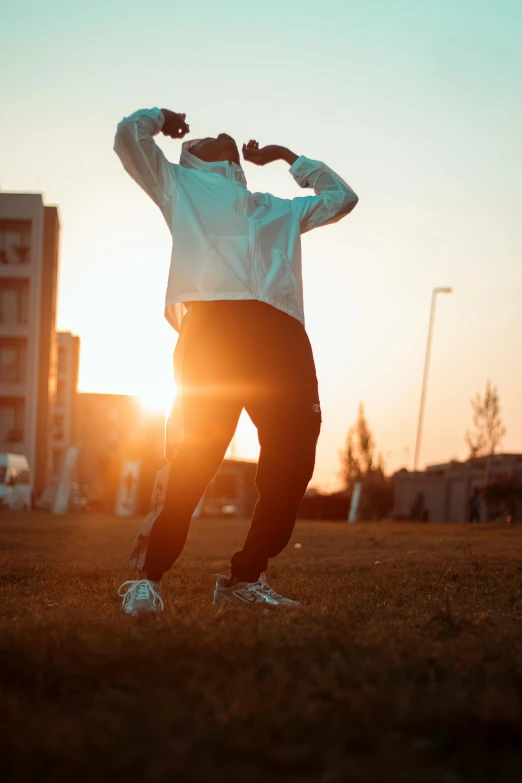 a man is posing for the camera with his arms outstretched