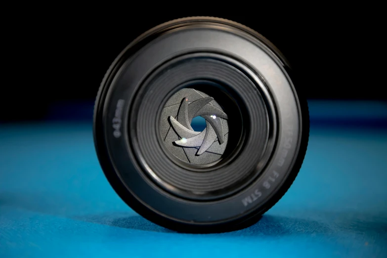 a metal object with some black and blue colors