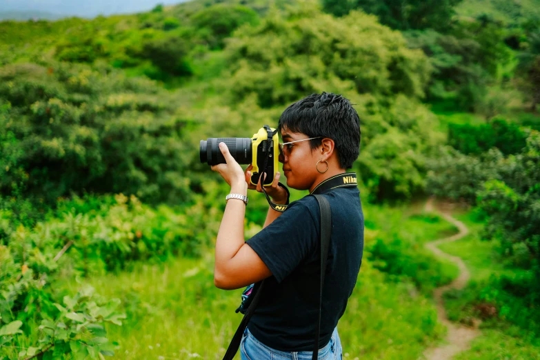 a young woman with her camera taking pictures