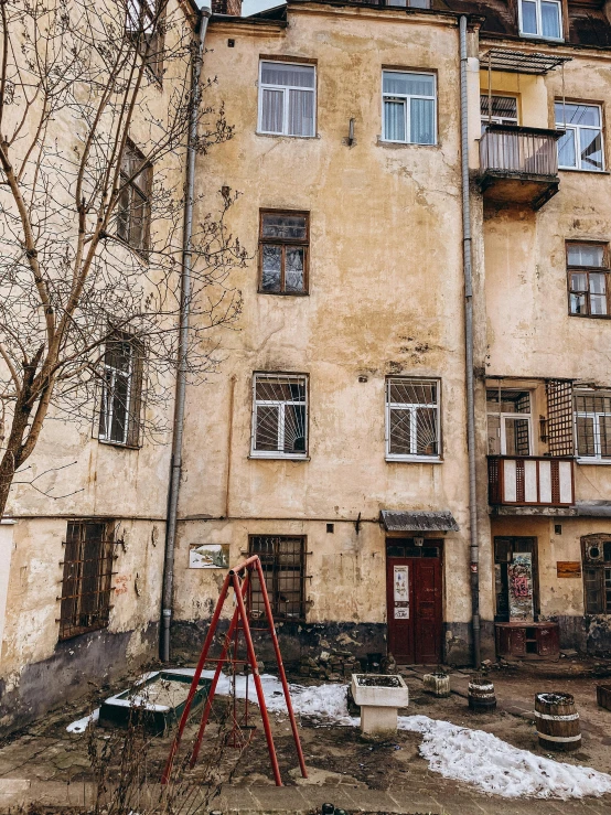 the old house is near the playground set in front of it