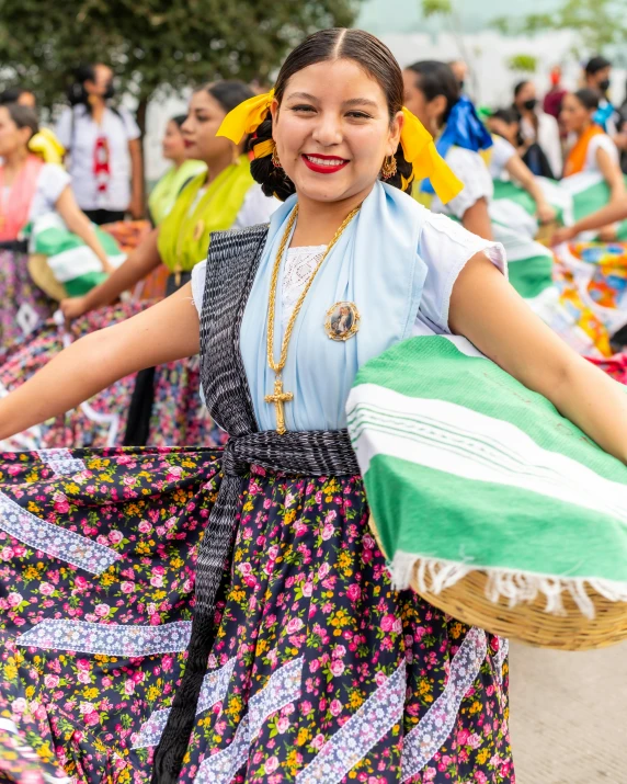 the people are performing in a colorful dress